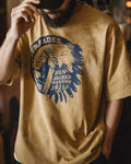 Man wearing the washed mustard amekaji tee with vintage Americana print