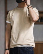 Man wearing the vintage apricot pocket tee with dark jeans, sleeves rolled
