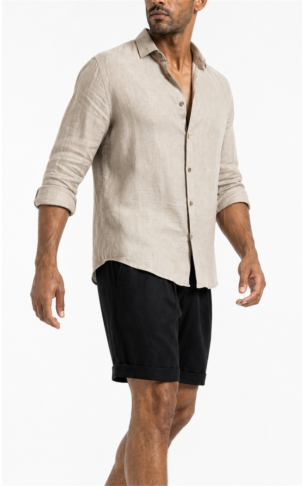 Model in beige linen shirt wearing black pleated shorts, side view