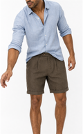 Man in light blue linen shirt wearing coffee pleated linen blend shorts