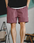 Washed burgundy retro training shorts with black tee — front crop