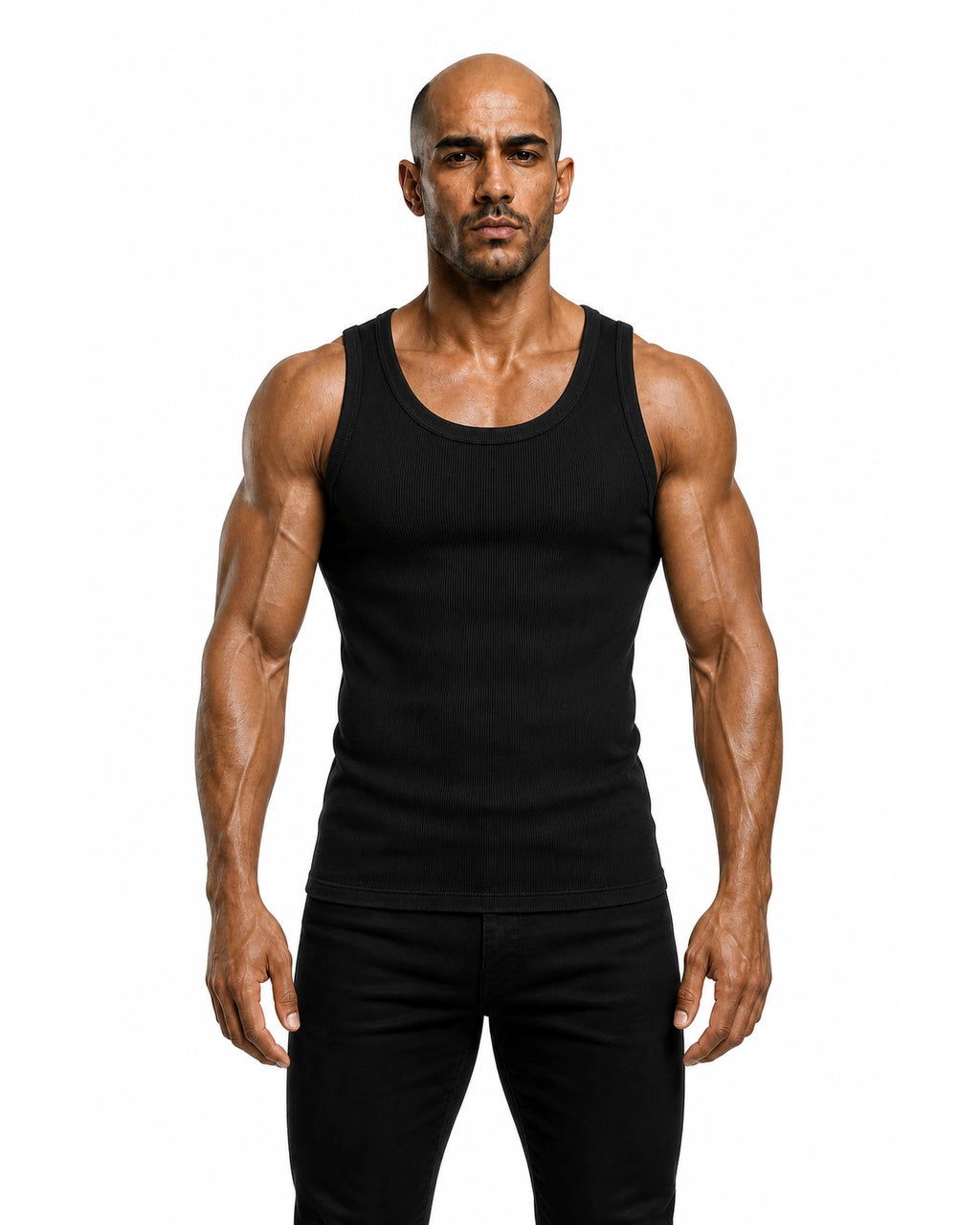 Man wearing the black premium ribbed tank with black trousers