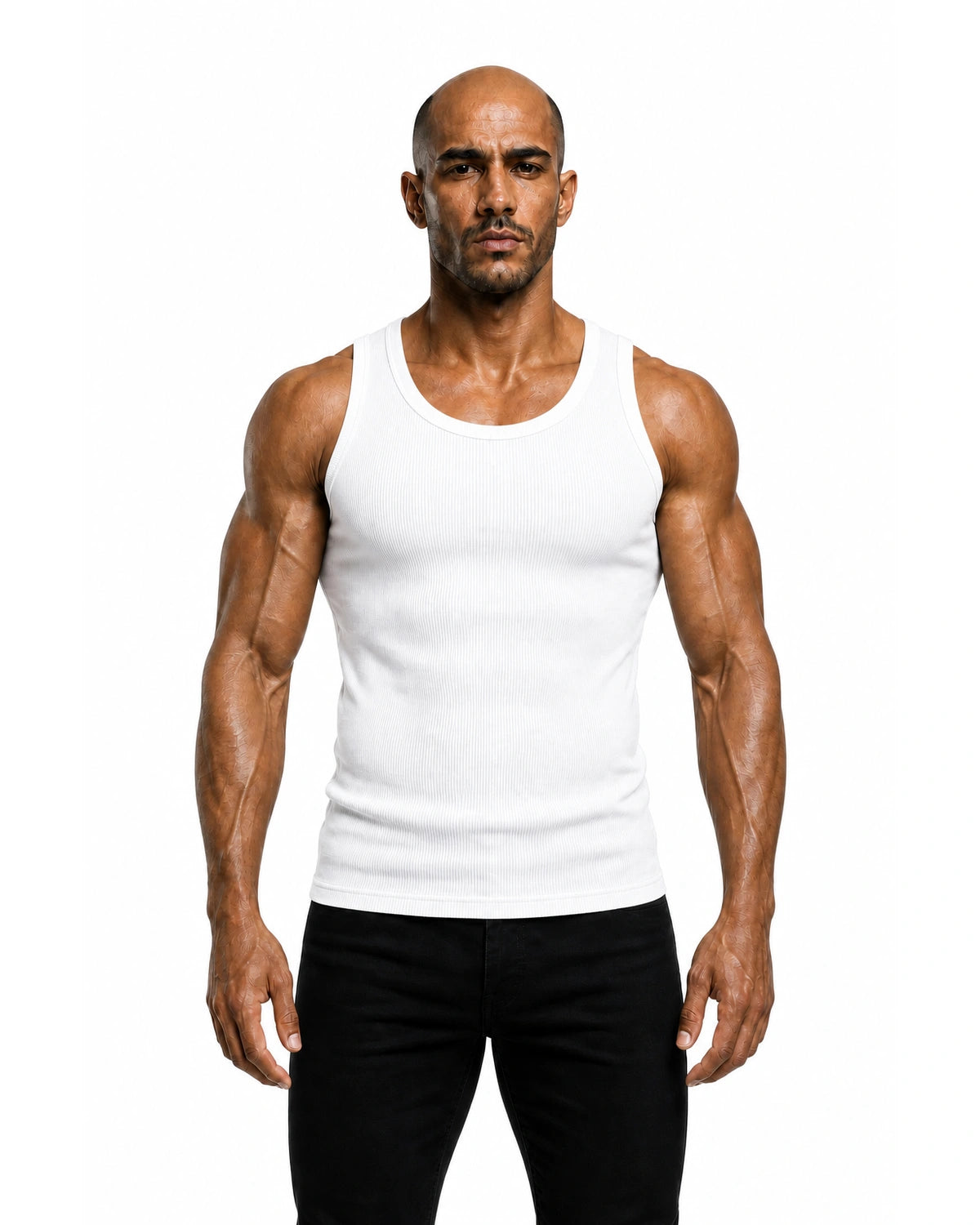 Man wearing the white premium ribbed tank with black trousers