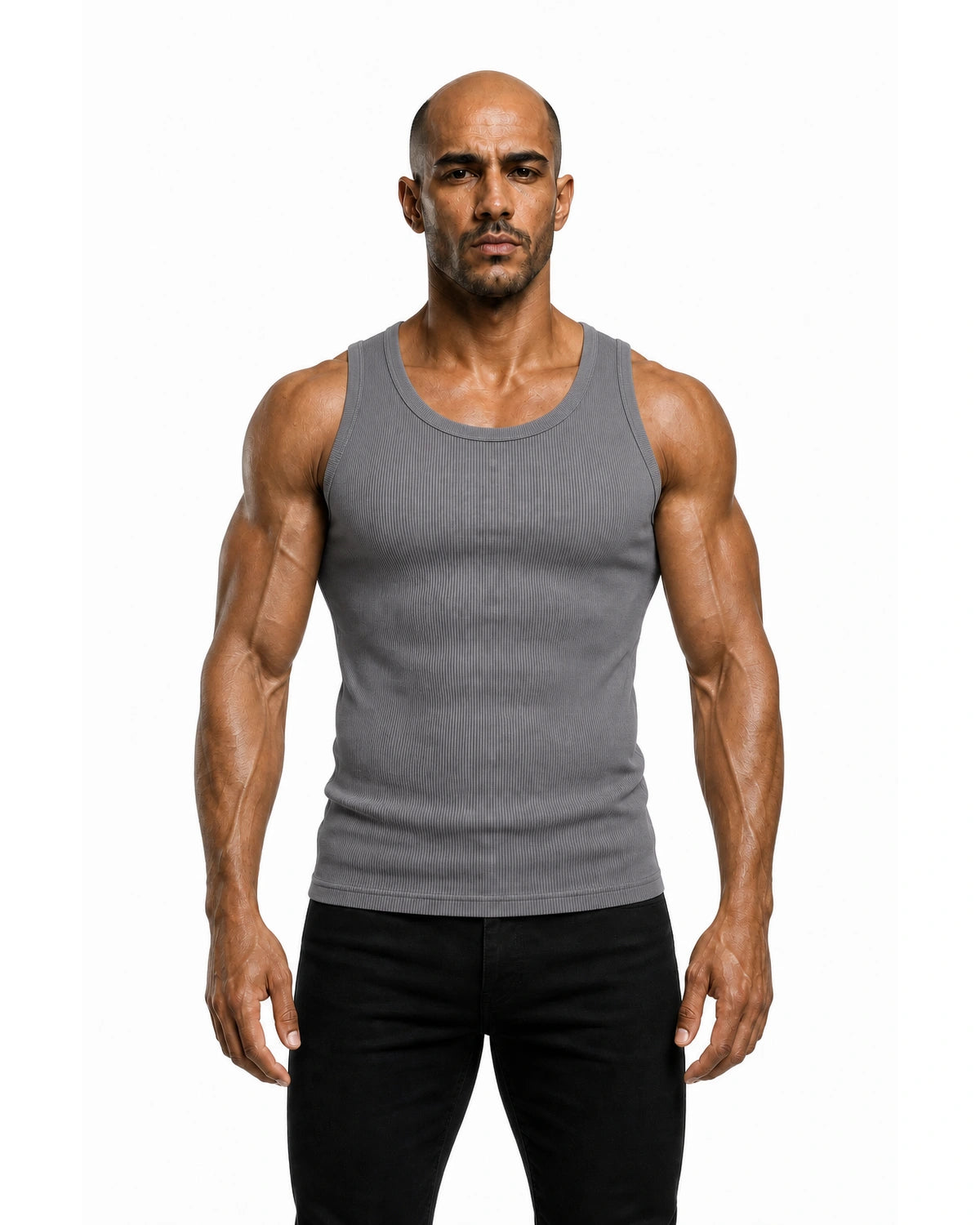 Man wearing the grey premium ribbed tank with black trousers