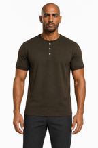 Man wearing the military green 3-button henley with dark trousers