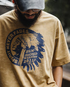 Man in the washed mustard amekaji tee and grey cap, front print visible