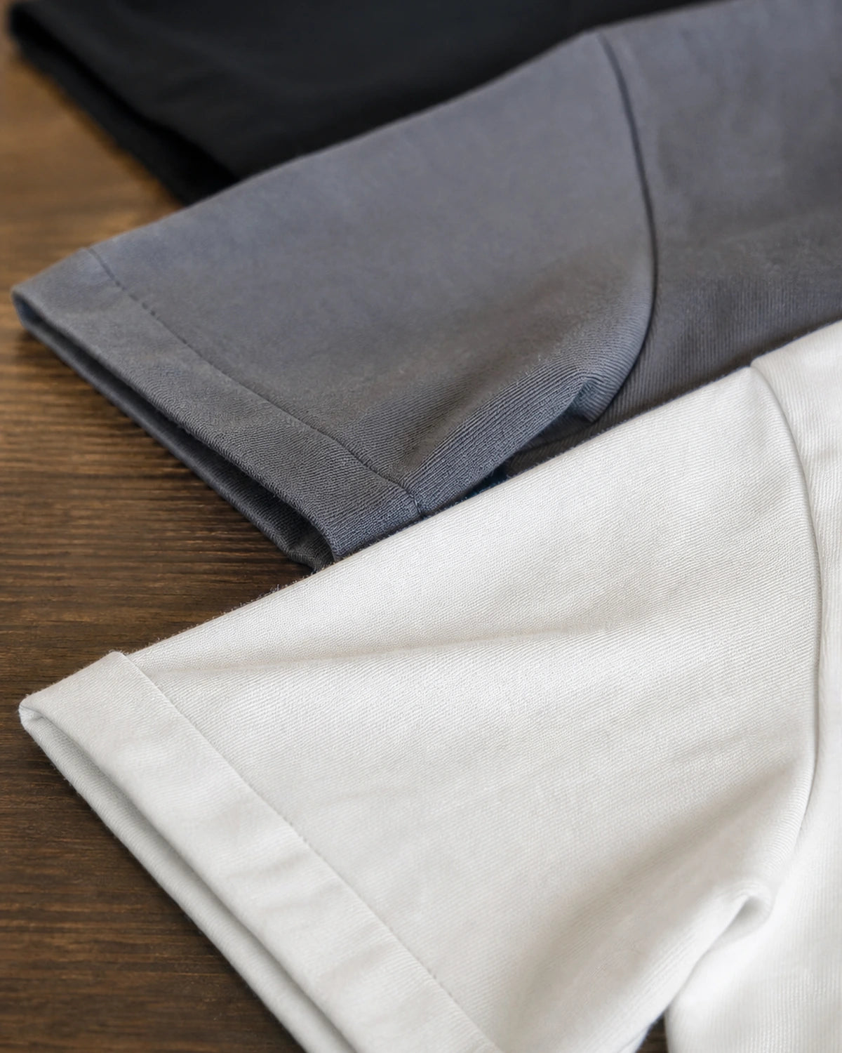 Close-up of the cotton fabric and stitched hem in grey and white