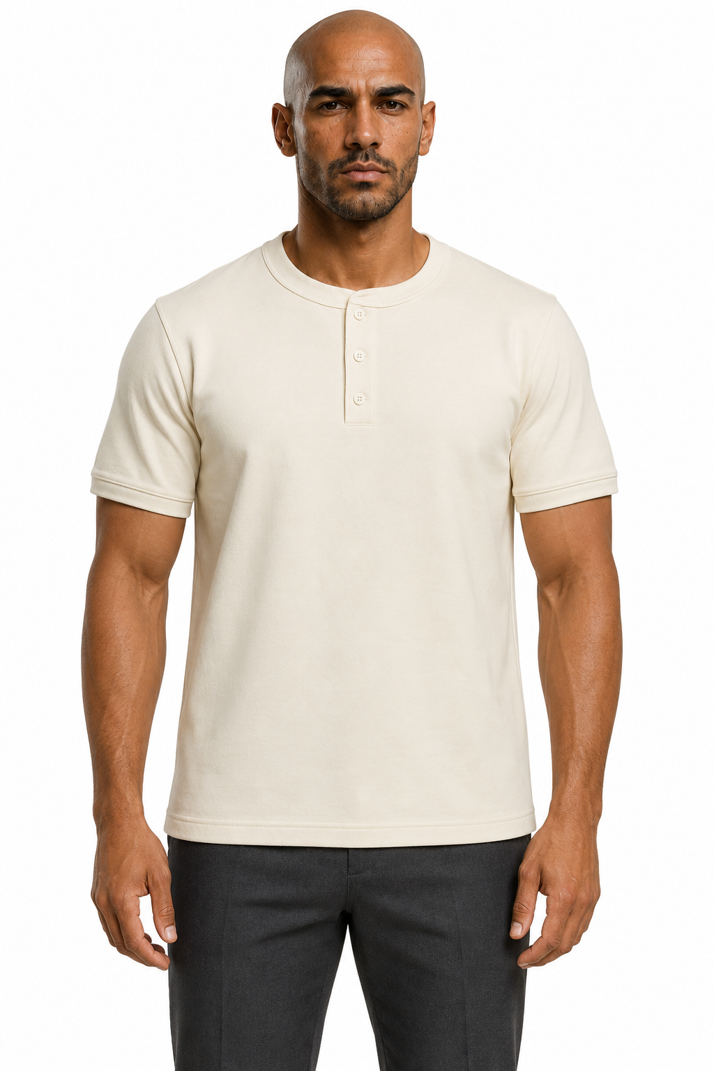 Man wearing the almond white 3-button henley with dark trousers