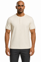 Man wearing the almond white 3-button henley with dark trousers