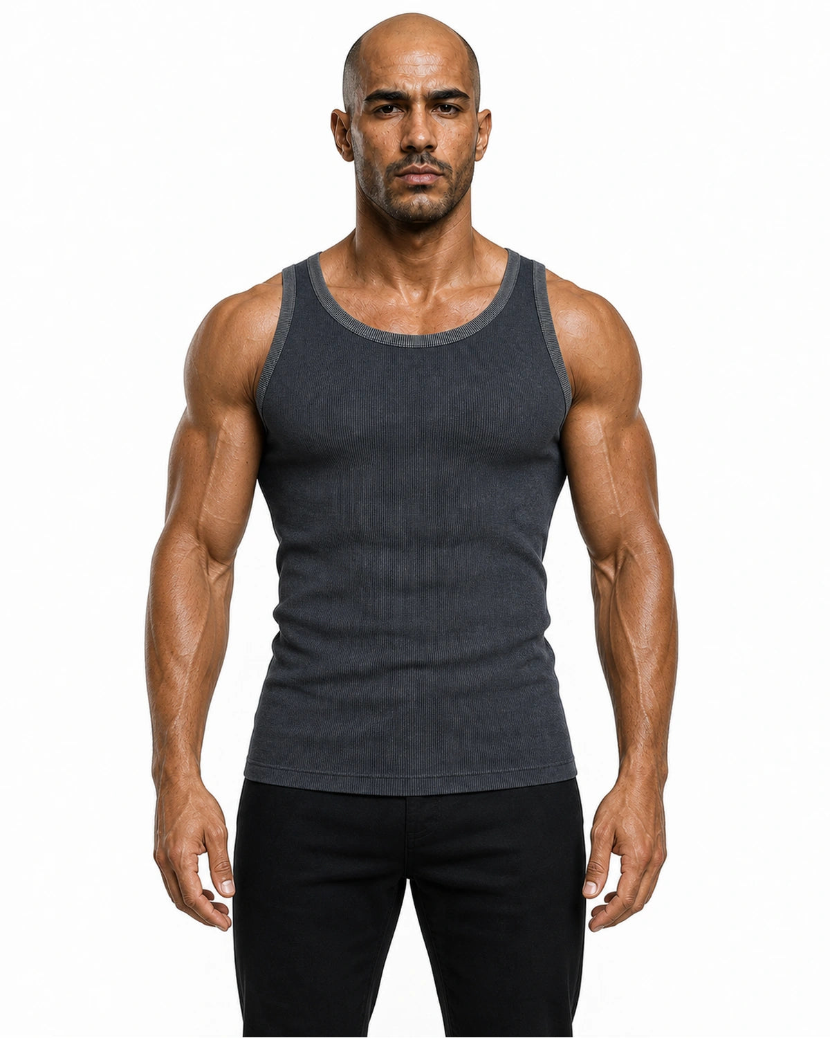 Man wearing the navy heather premium ribbed tank with black trousers