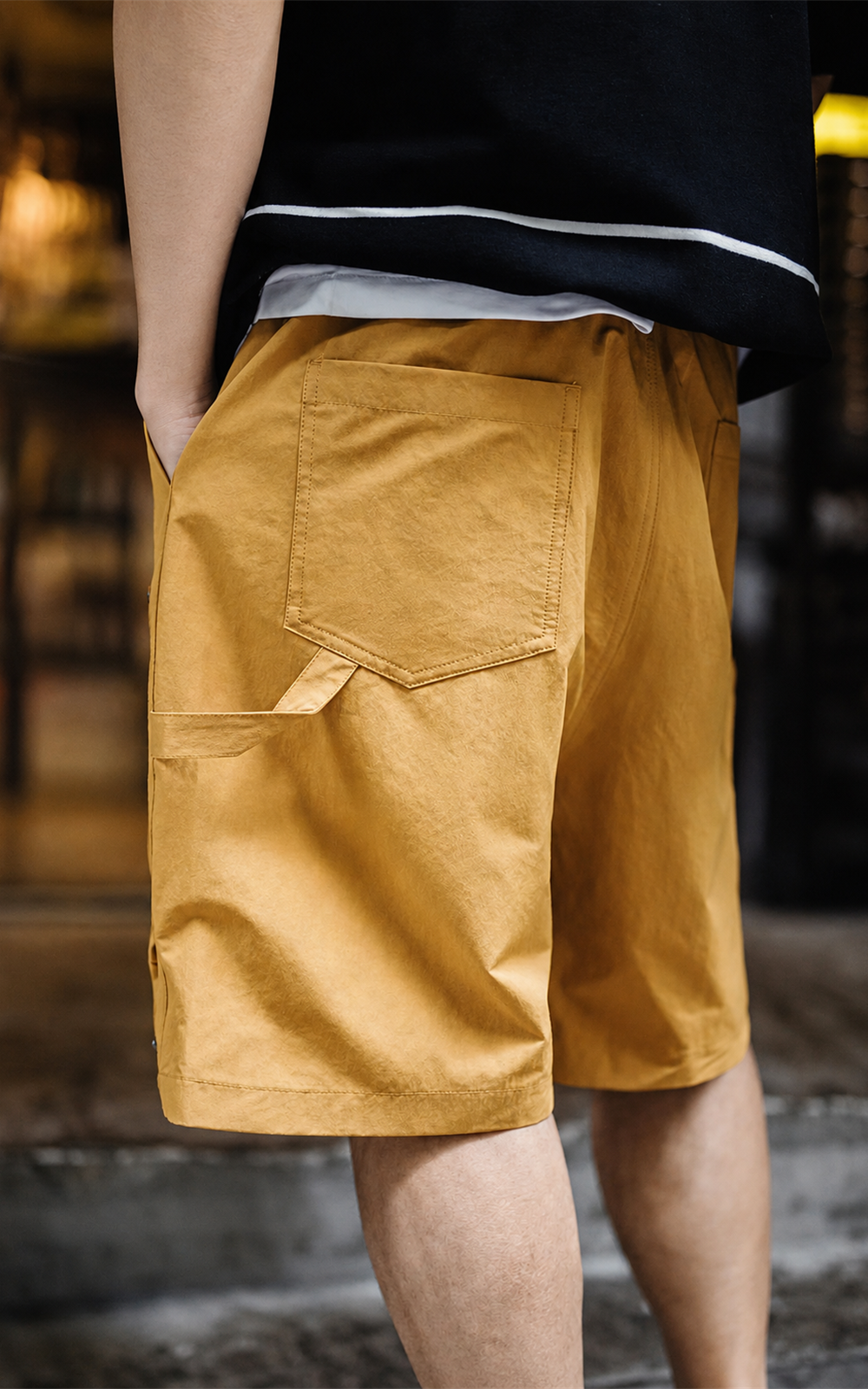 Back patch pocket and hammer loop on canvas yellow shorts