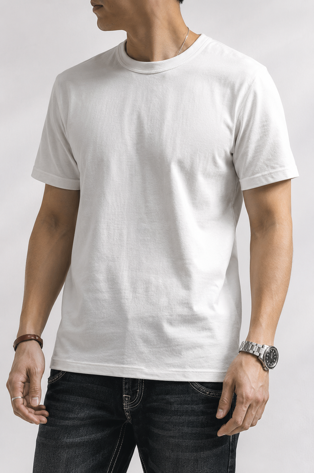 White heavyweight cotton t-shirt worn with dark jeans, front torso view