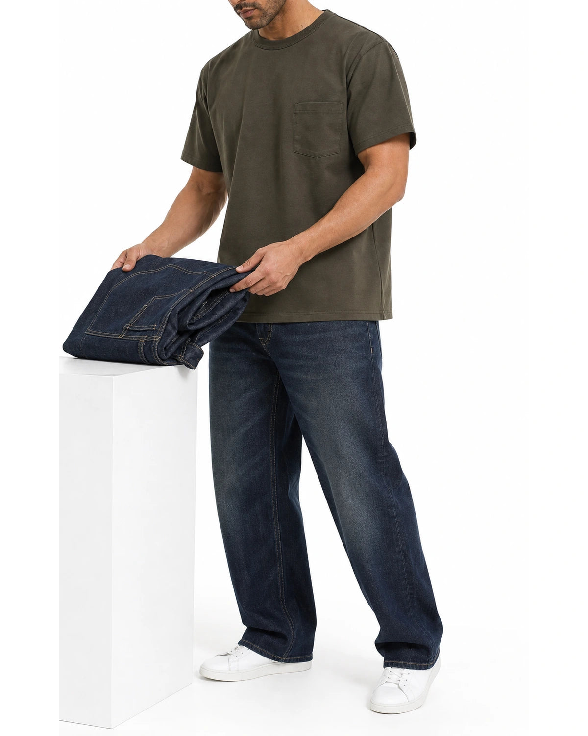 Man wearing the graphite green pocket tee with blue jeans, full view