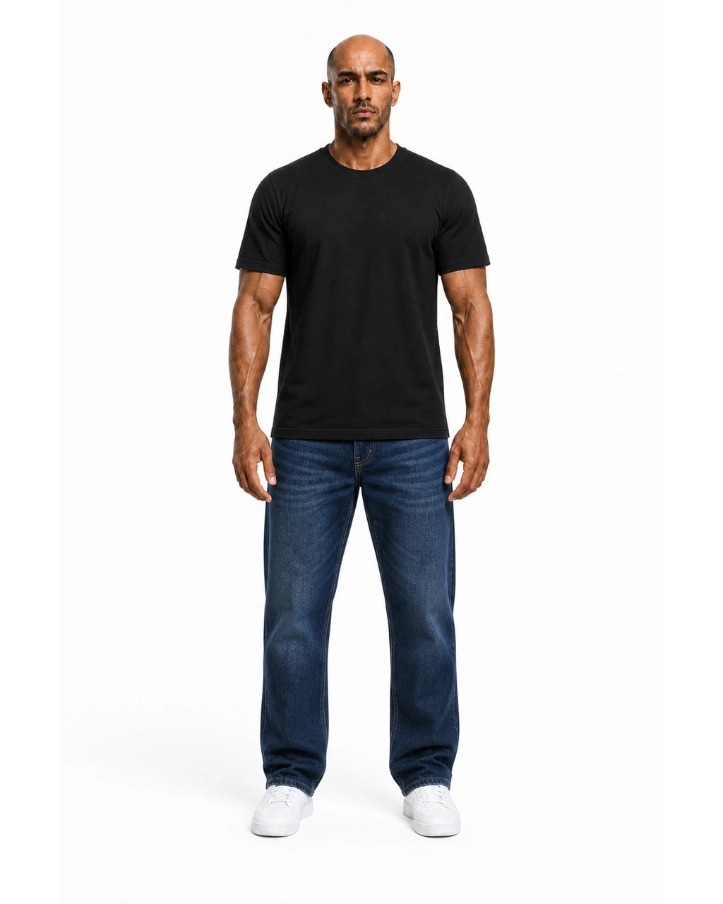 Man wearing the black heavyweight tee with blue jeans, full view