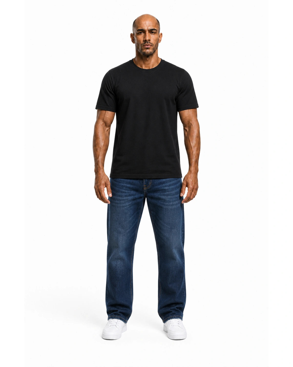 Man wearing the black heavyweight tee with blue jeans, full view