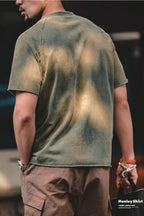 Back view of the washed olive henley showing the stone-wash fade