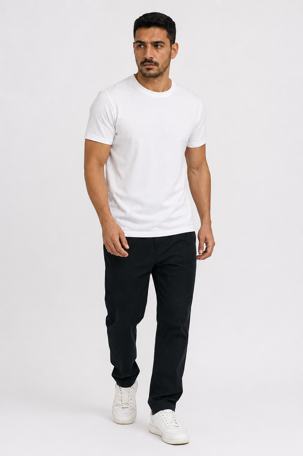 Man wearing the white heavyweight tee with black trousers, full view