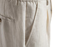Side detail of slant pocket and buttoned back welt pocket
