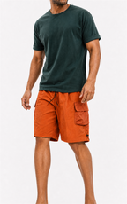 Man in MANLY orange shorts and teal tee — full front view