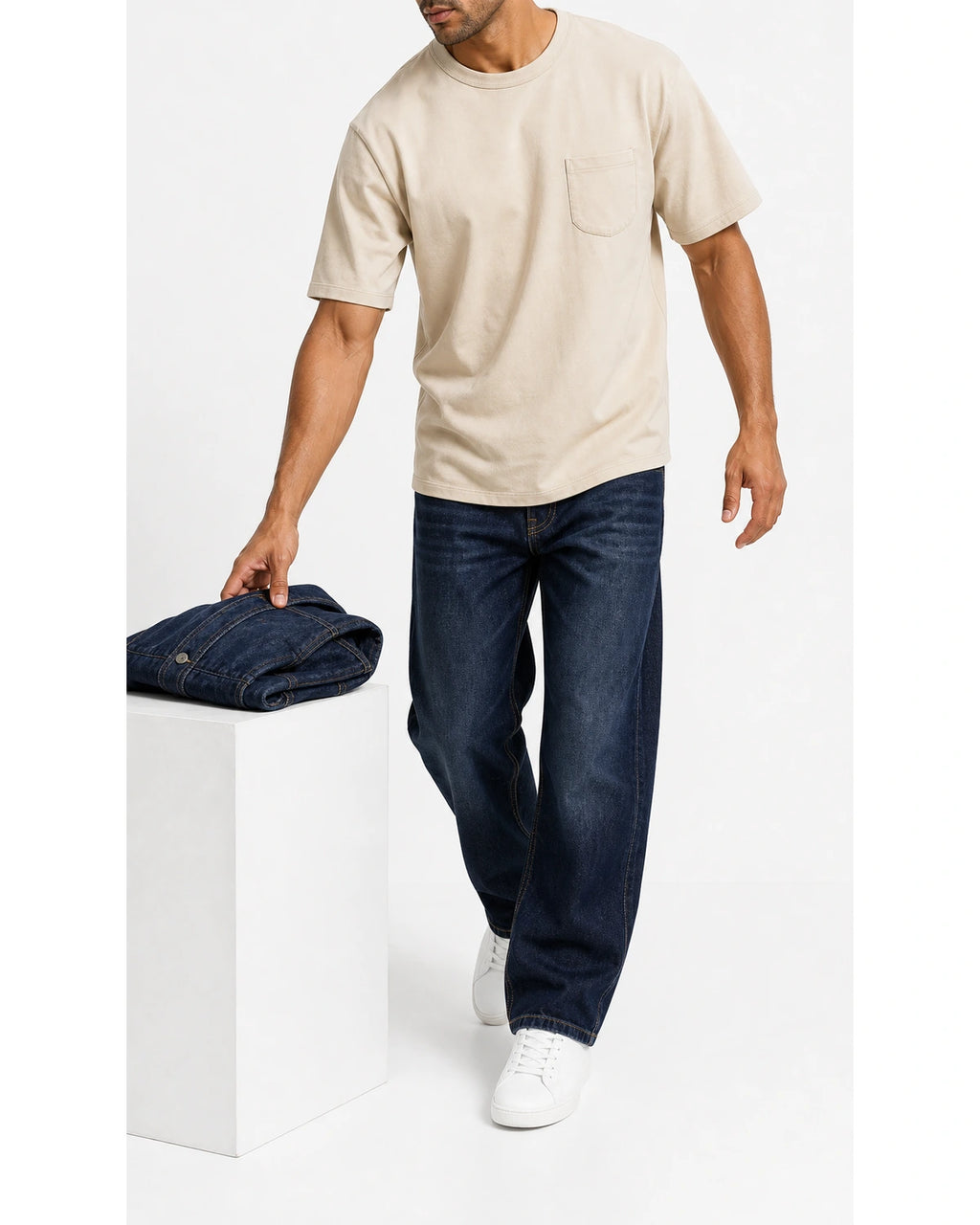 Man wearing the vintage apricot pocket tee with blue jeans, full view