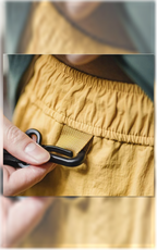 Elastic waistband loop with metal clip — detail