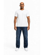 Man wearing the white heavyweight tee with blue jeans, full view