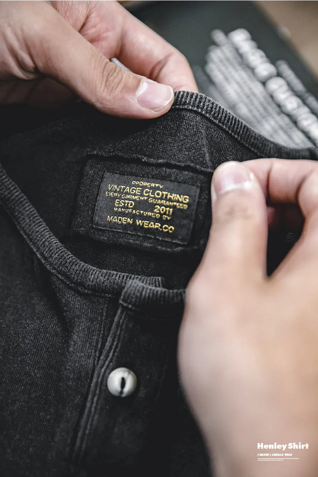 Close-up of the washed black henley's woven interior label