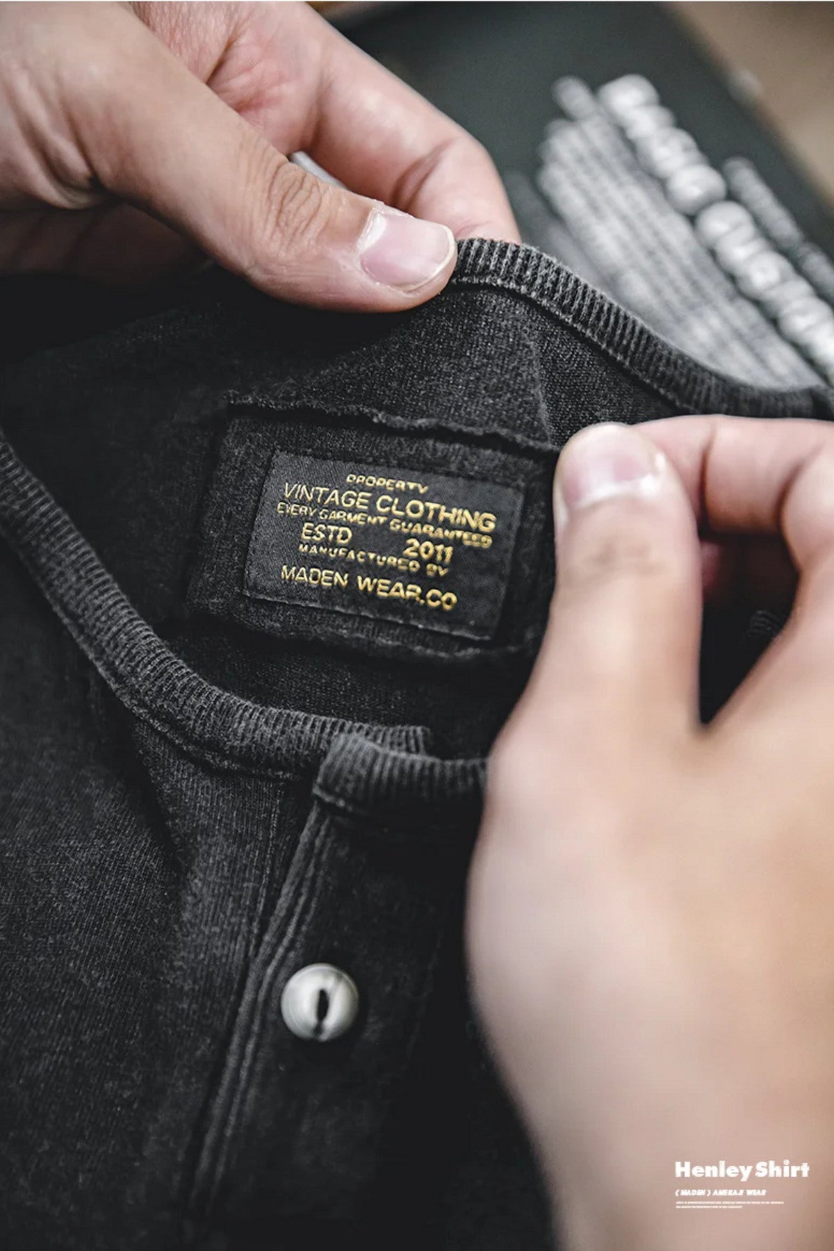 Close-up of the washed black henley's woven interior label