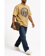 Man wearing the washed mustard amekaji tee with blue jeans, full view