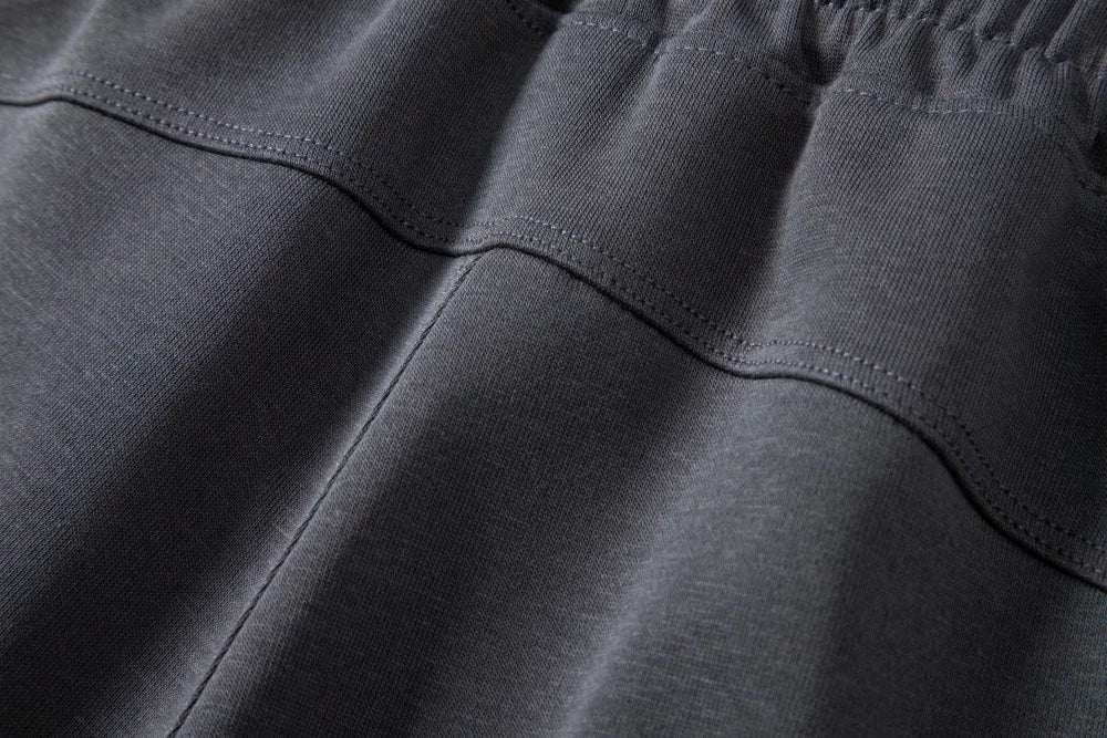 Back yoke seam detail on dark gray knit shorts