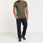 Man wearing the army green textured crew neck t-shirt with dark trousers