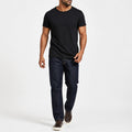 Man wearing the black textured crew neck t-shirt with dark trousers