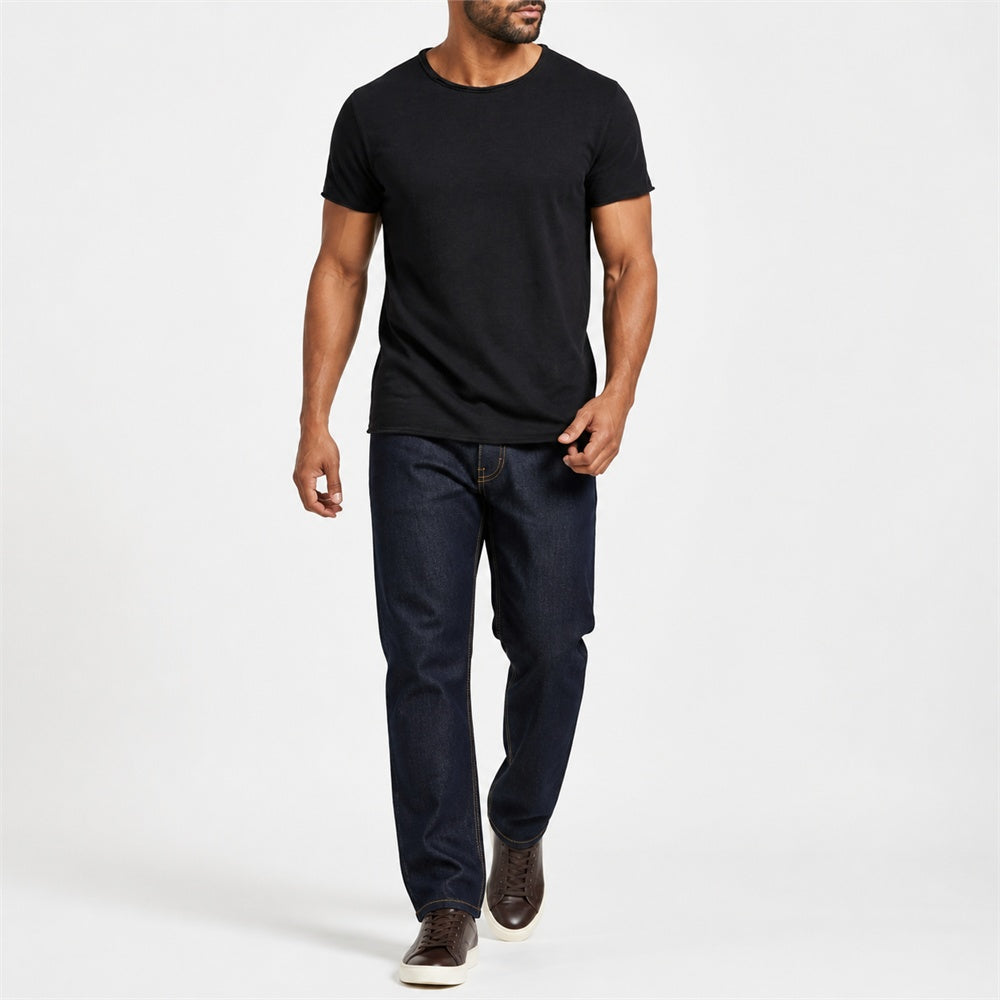 Man wearing the black textured crew neck t-shirt with dark trousers