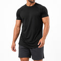 Man wearing the black athletic gym tee with training shorts