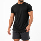 Man wearing the black athletic gym tee with training shorts