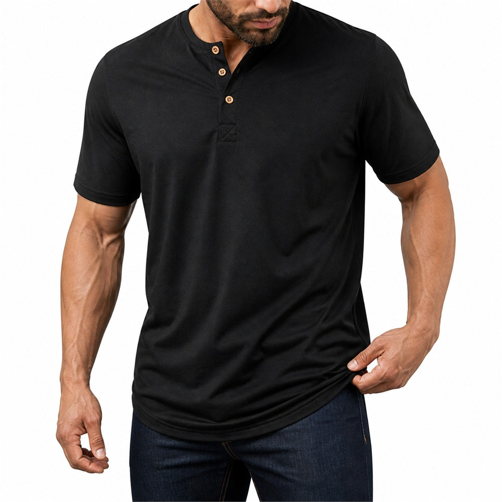 Man wearing the black everyday henley with dark jeans