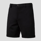 Black men's shorts product shot — button waist, zip fly, cuffed hem