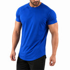 Man wearing the royal blue athletic gym tee with training shorts