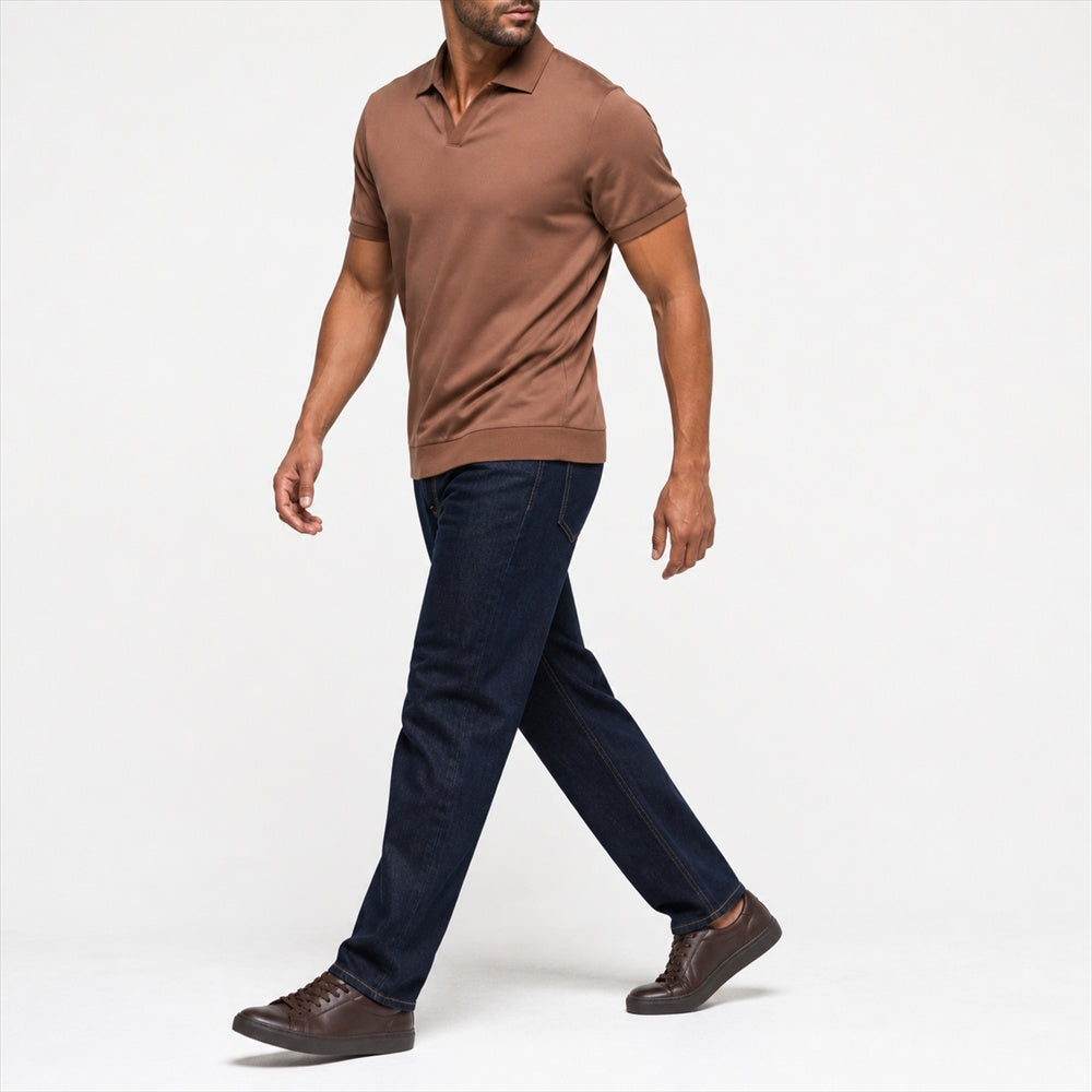 Man wearing the brown open-collar polo with dark jeans