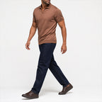 Man wearing the brown open-collar polo with dark jeans