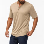 Man wearing the khaki everyday henley with dark trousers