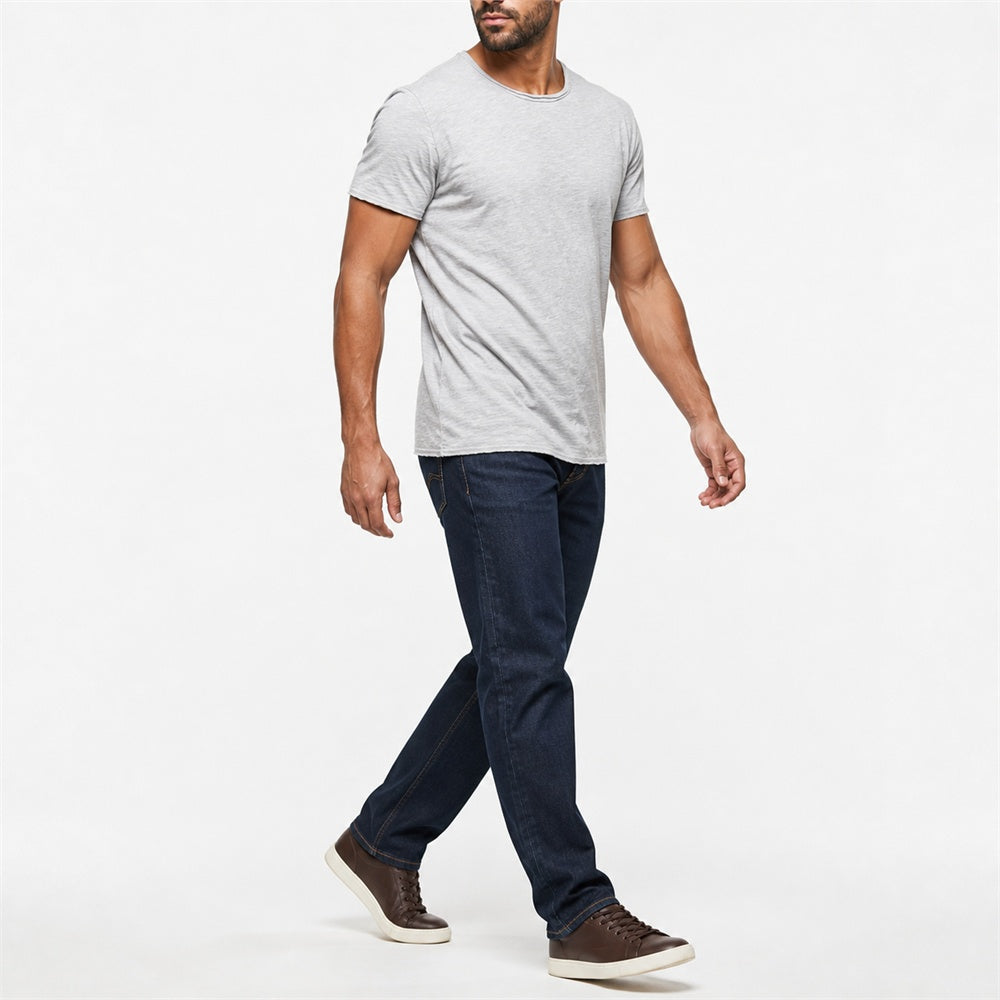 Man wearing the light gray textured crew neck t-shirt with dark trousers