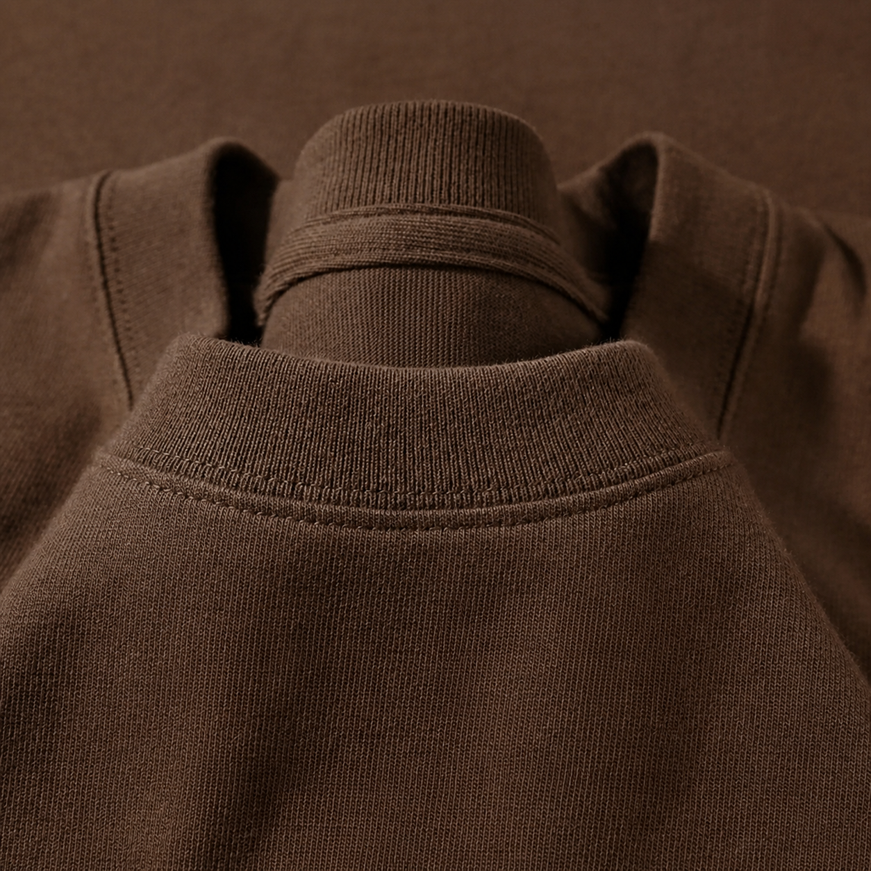 Close-up of the crew neckline on the Men's Plain Heavyweight Tee in Mocha Brown