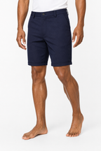 Navy shorts on model with white tee — above-the-knee fit