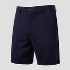 Navy men's shorts product shot — belt loops, slant pockets, cuffed hem