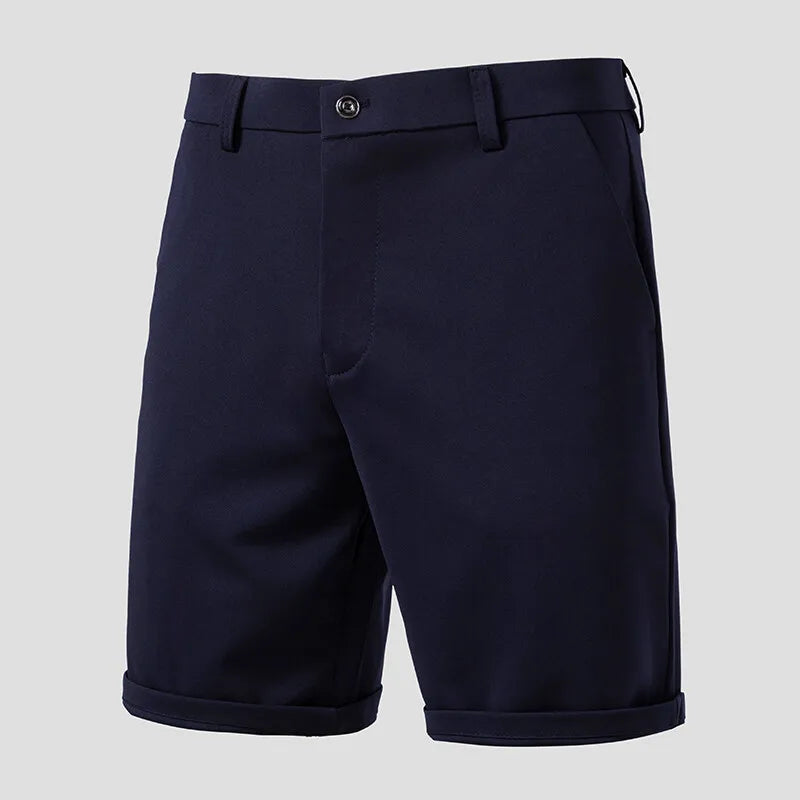 Navy men's shorts product shot — belt loops, slant pockets, cuffed hem