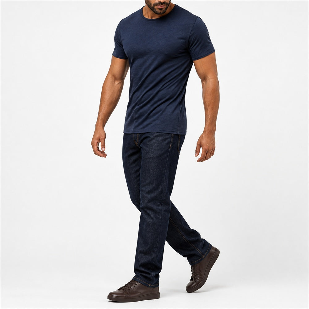 Man wearing the navy blue textured crew neck t-shirt with dark trousers