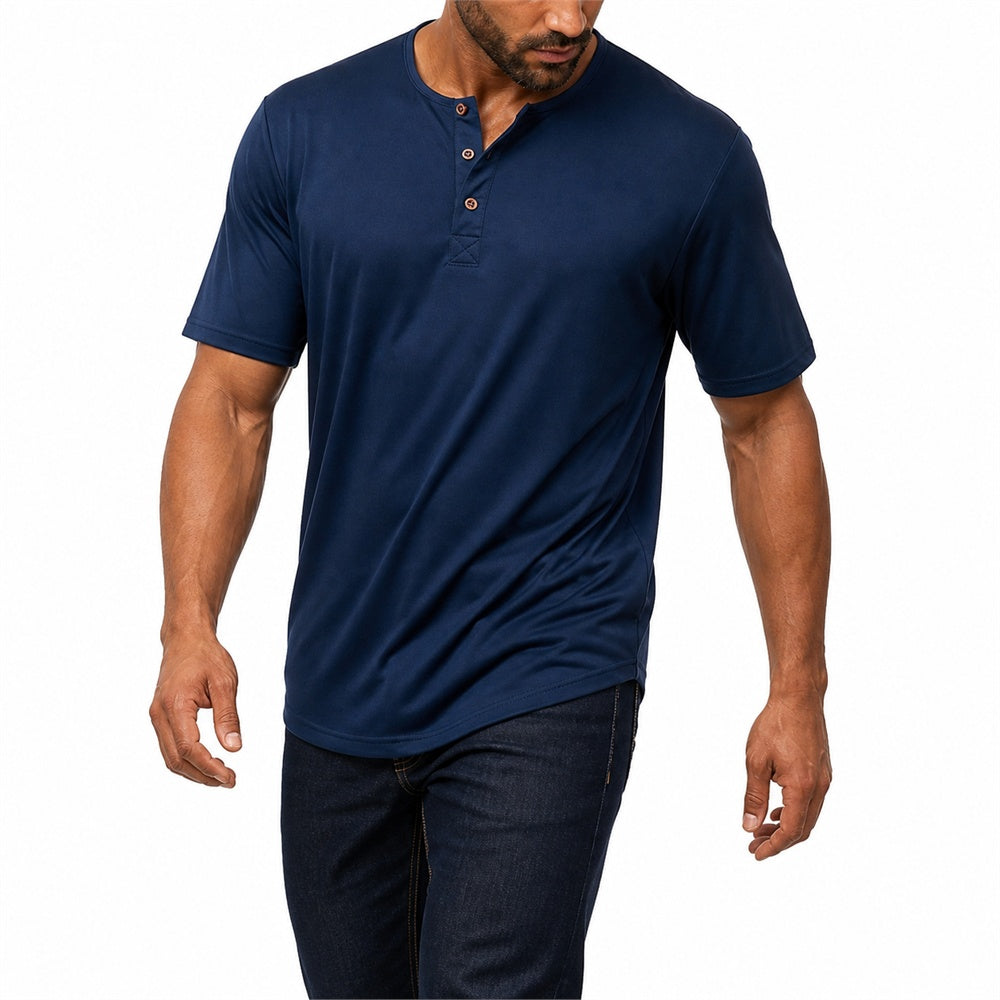 Man wearing the navy blue everyday henley with dark jeans