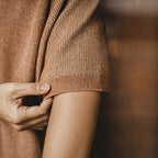 Close-up of the knitted tee's ribbed sleeve cuff