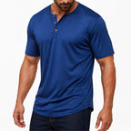 Man wearing the royal blue everyday henley with dark jeans